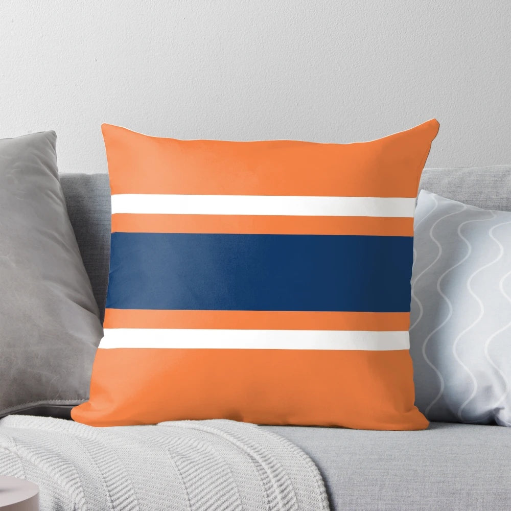 Orange, white, and navy power stripe pillow with sporty design