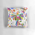 Colorful Otomi bird pattern print on a fluffy throw pillow, perfect for bohemian home decor