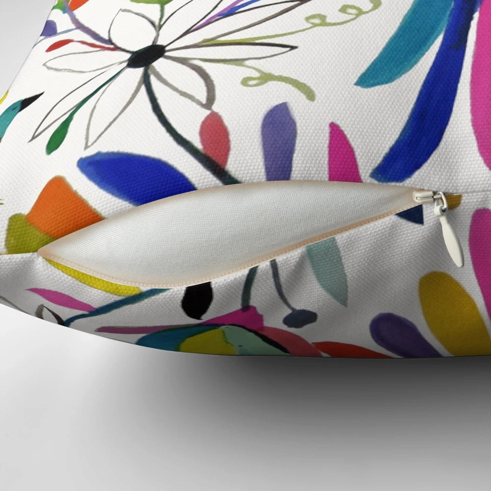 Colorful Otomi bird pattern print on a fluffy throw pillow, perfect for bohemian home decor