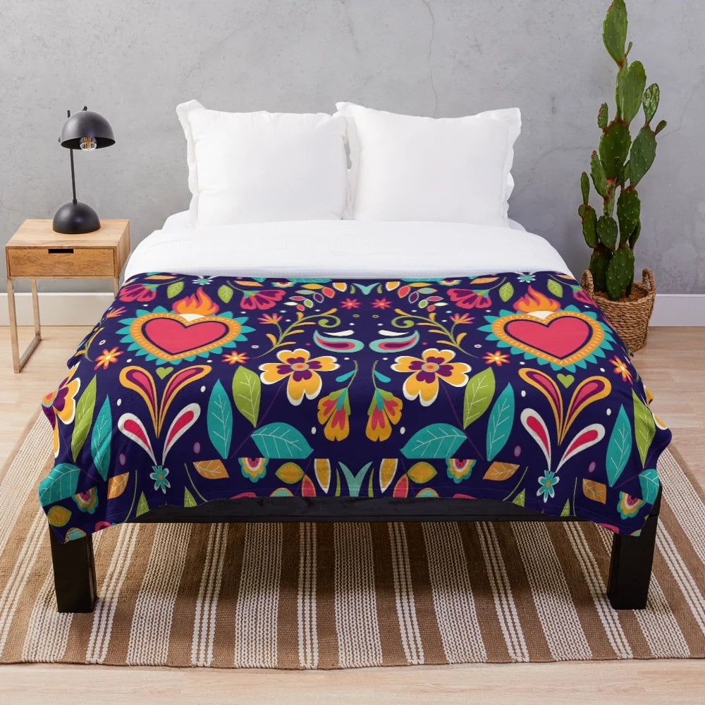Otomi embroidered plush blanket with colorful bird and flower patterns