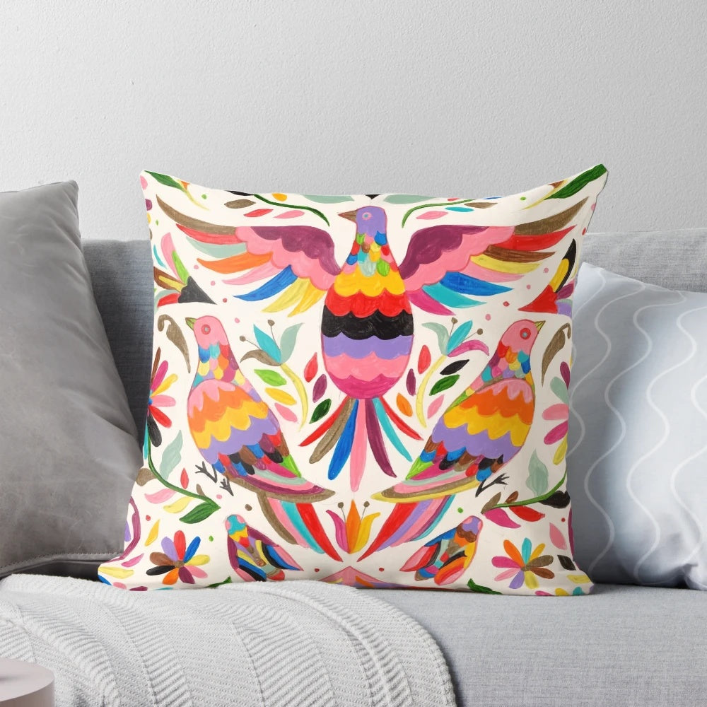 Colorful Otomi-inspired bird pattern on a decorative throw pillow
