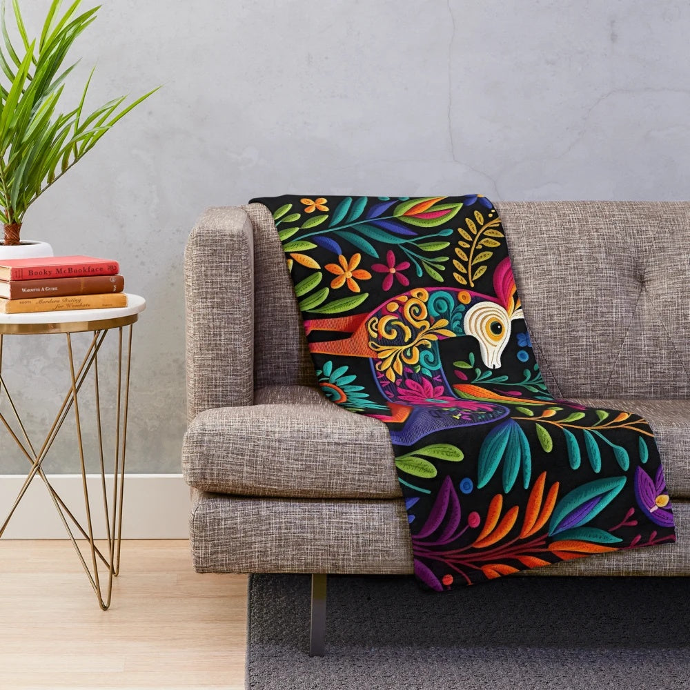 Colorful otomi-inspired plush blanket with floral and bird motifs
