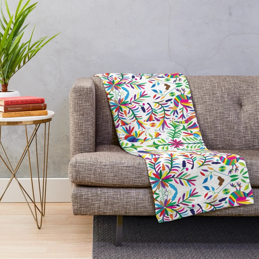 Otomi-inspired colorful plush blanket with vibrant floral and geometric patterns