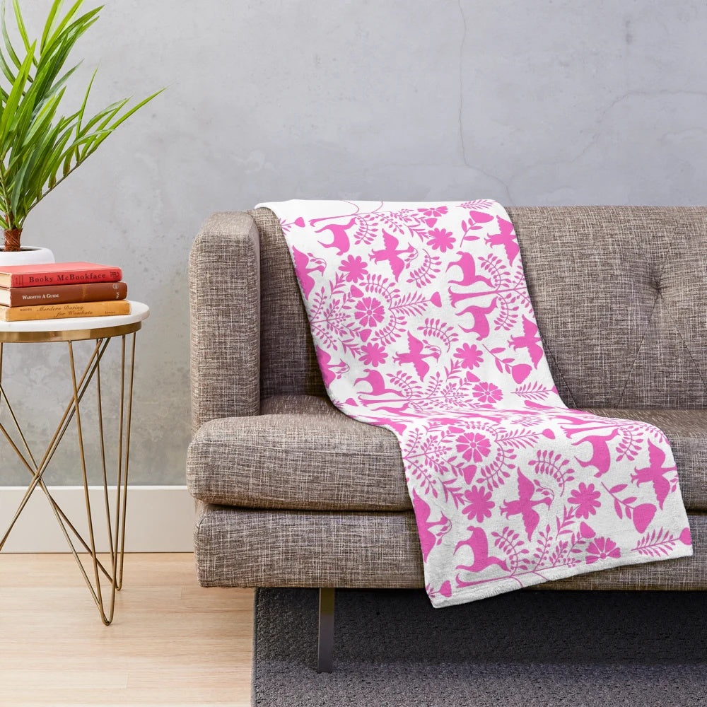 Colorful Otomi-inspired plush blanket with Mexican folk art patterns
