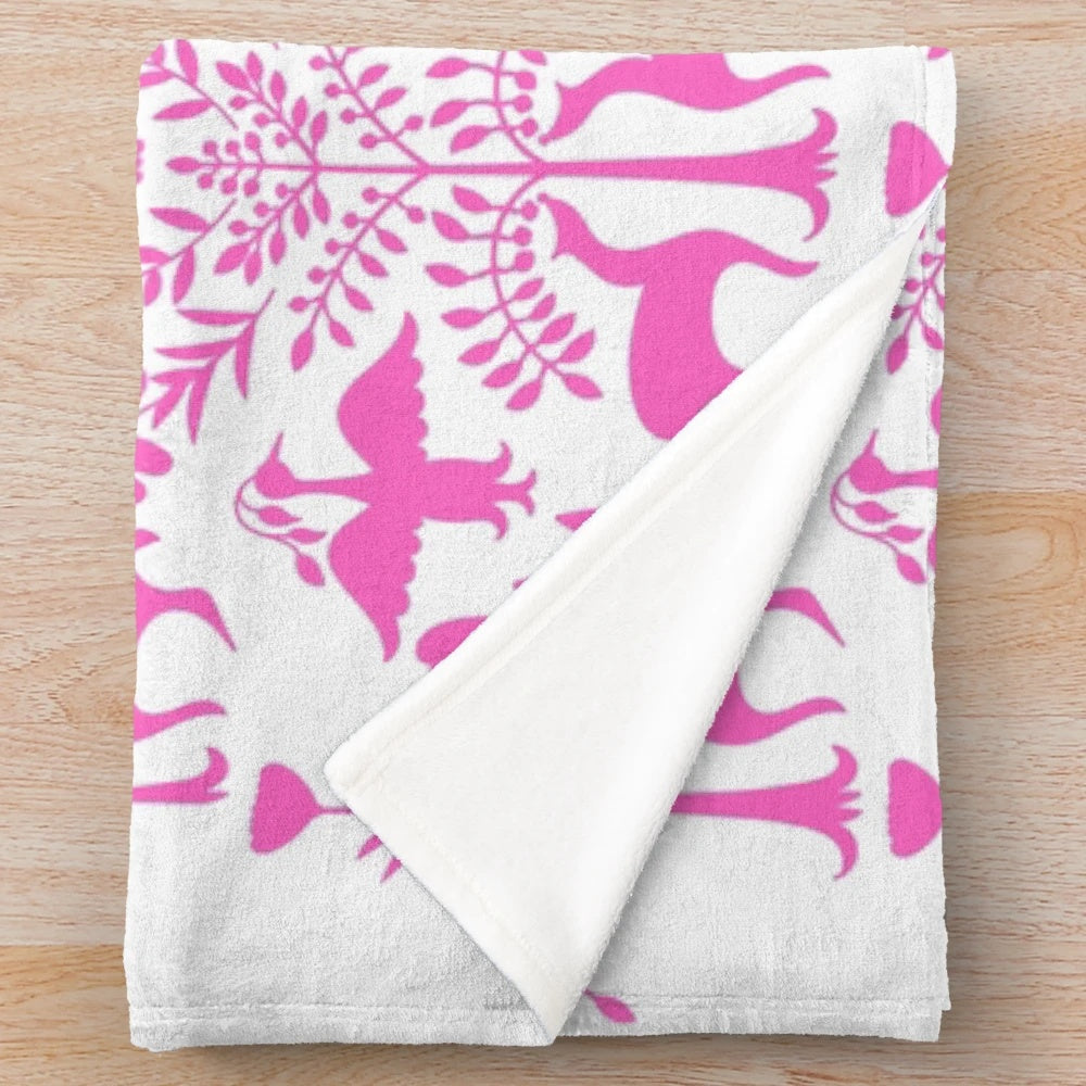 Colorful Otomi-inspired plush blanket with Mexican folk art patterns