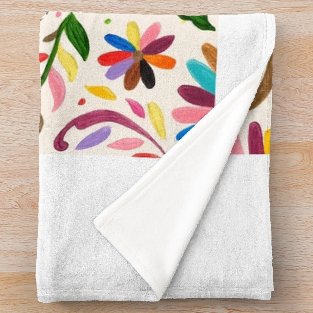 Otomi-inspired plush blanket with colorful Mexican folk art patterns