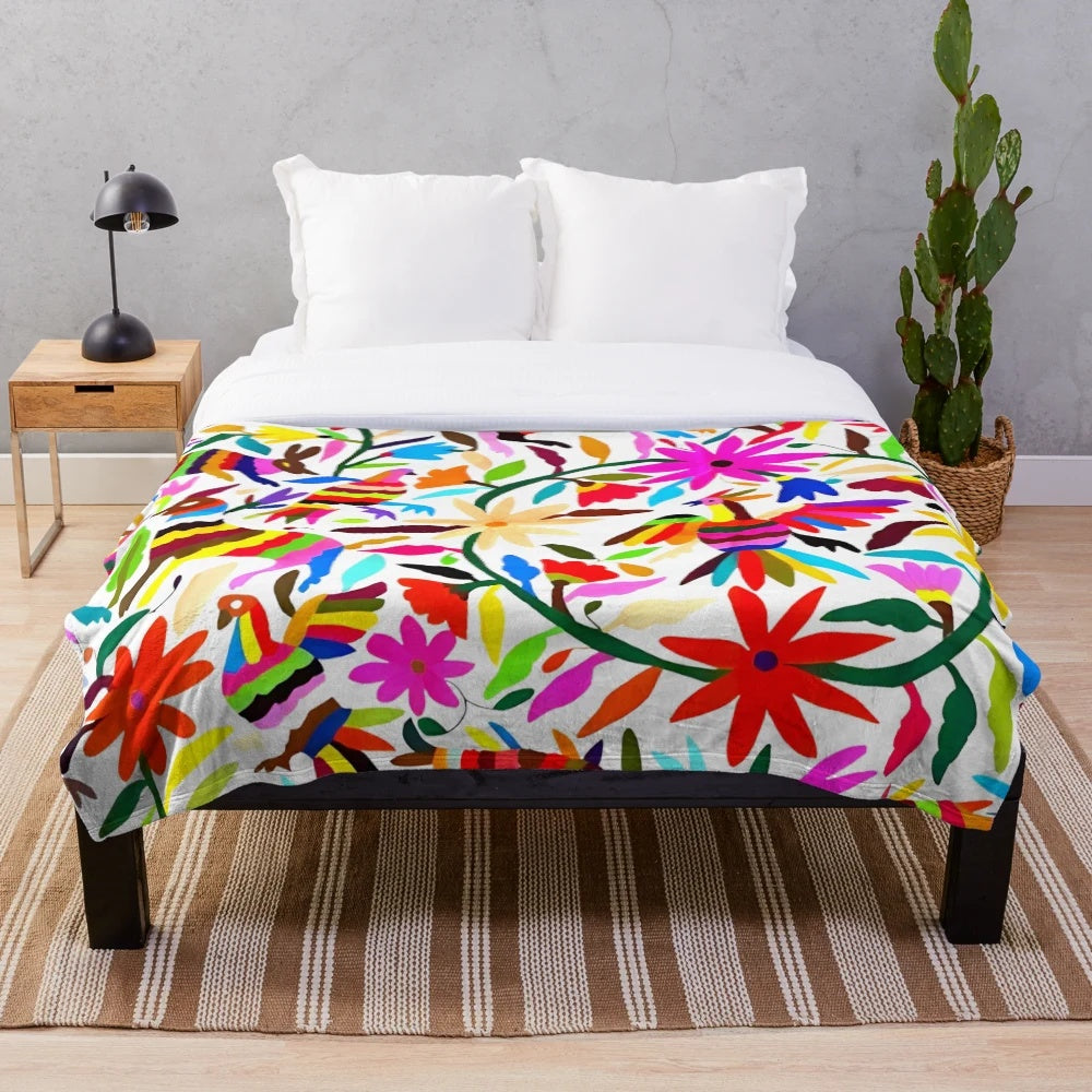 Colorful Otomi Tenango inspired plush blanket with floral and nature motifs
