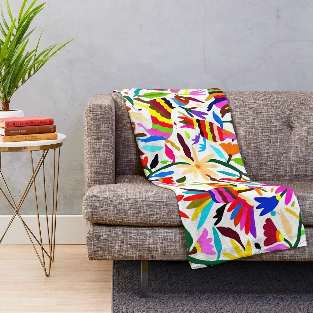 Colorful Otomi Tenango inspired plush blanket with floral and nature motifs