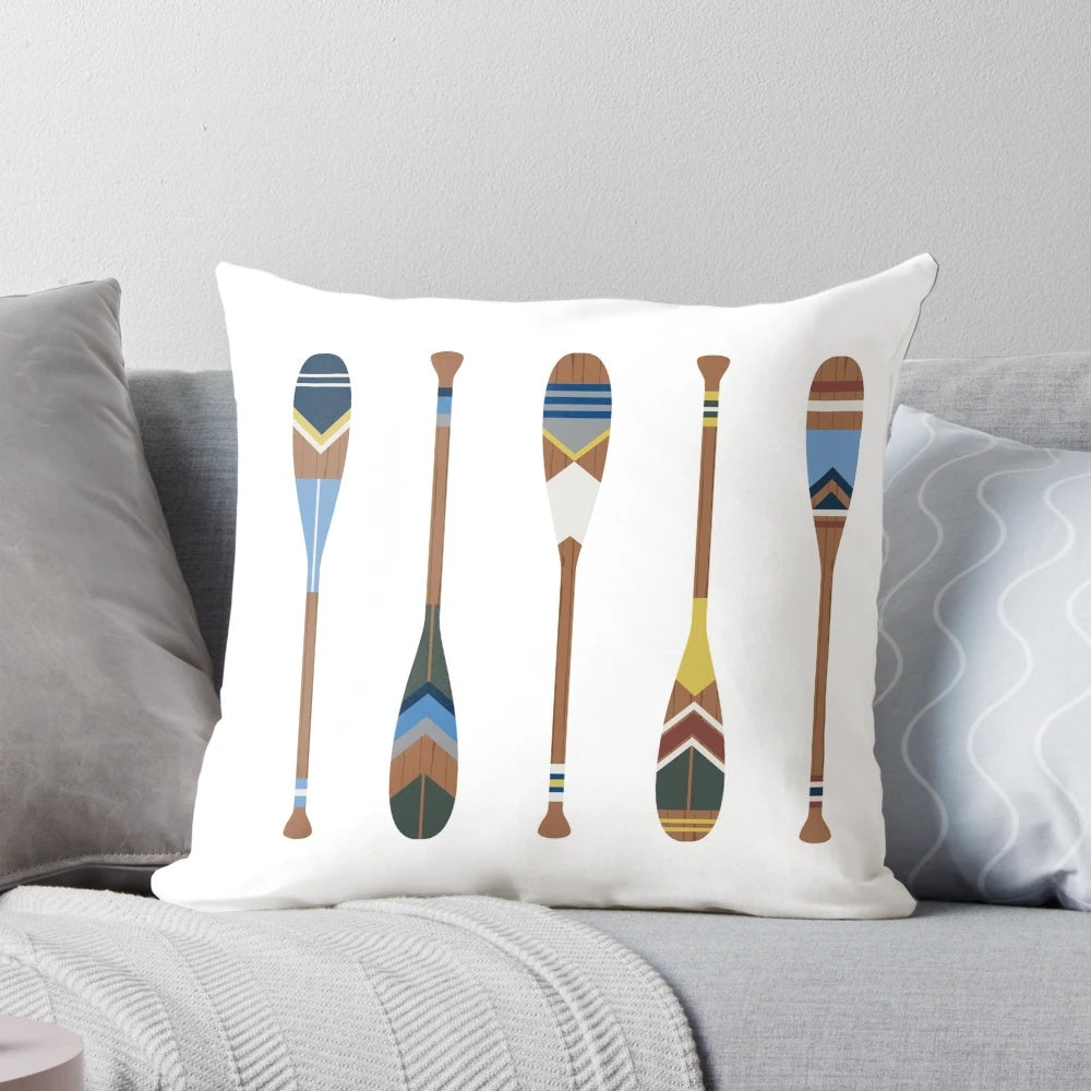 Vibrant decorative pillow featuring a painted oar design, perfect for coastal, boho, and lake house style home decor.
