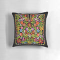 Colorful embroidered pillow featuring traditional Palestinian flowers and patterns