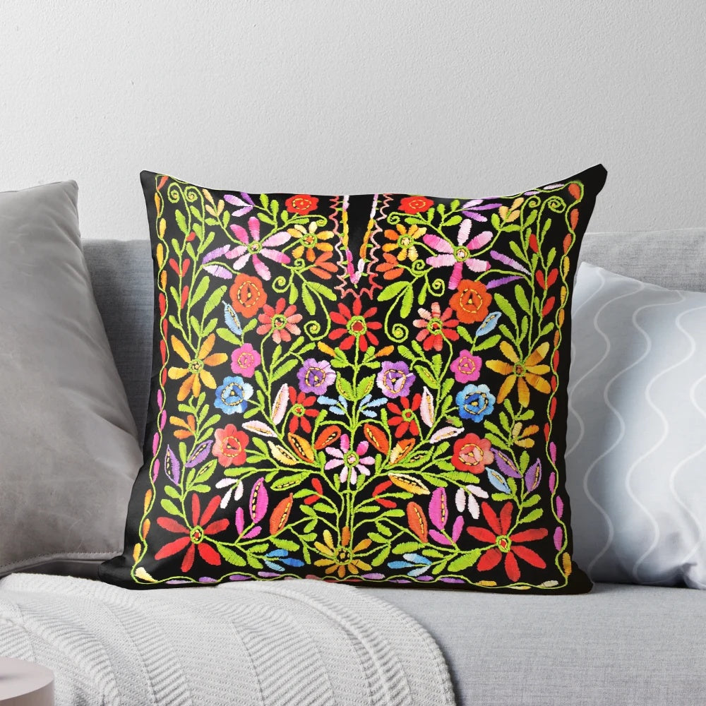 Colorful embroidered pillow featuring traditional Palestinian flowers and patterns