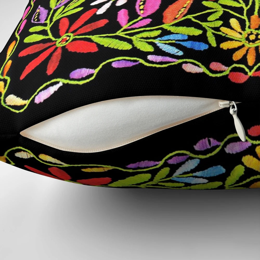Colorful embroidered pillow featuring traditional Palestinian flowers and patterns