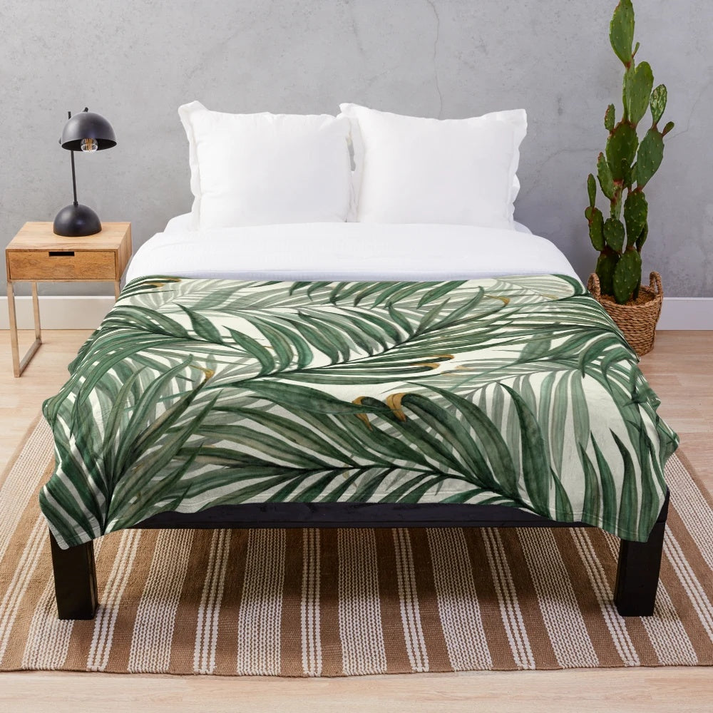 Soft, plush blanket featuring a watercolor palm leaves design in a lush, green color palette