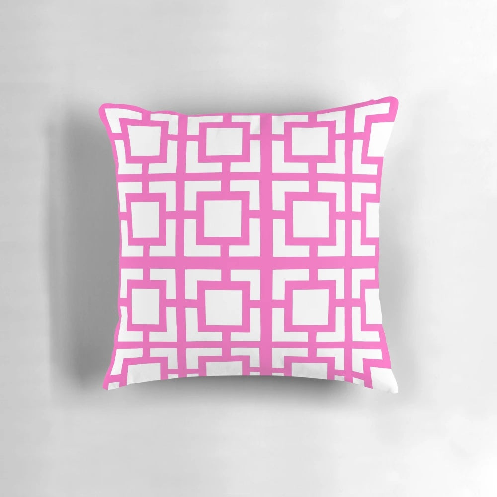 A soft, pink throw pillow with a mid-century modern breeze block design, perfect for adding a touch of Palm Springs style to your home.