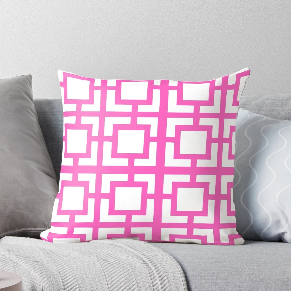 A soft, pink throw pillow with a mid-century modern breeze block design, perfect for adding a touch of Palm Springs style to your home.
