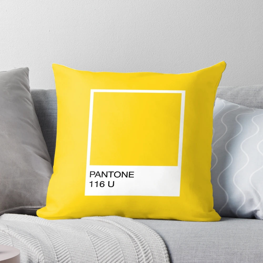 Bright yellow Pantone-inspired pillow with a fun, whimsical minion design.