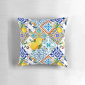 Colorful patchwork pillow featuring a mosaic of azulejo-style Portuguese tiles and vibrant citrus and lemon motifs.