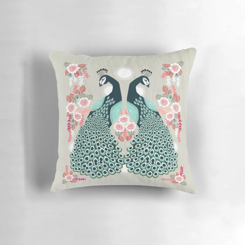 Colorful decorative throw pillow featuring a vibrant peacock design by artist Andrea Lauren
