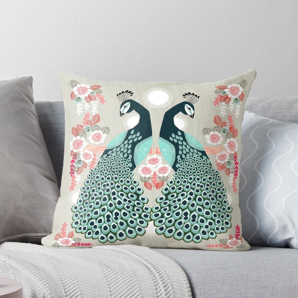 Colorful decorative throw pillow featuring a vibrant peacock design by artist Andrea Lauren