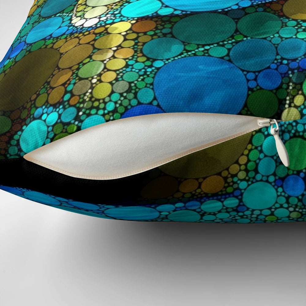 Peacock-inspired abstract art pillow in turquoise, blue, green, and black with gold accents