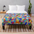 Colorful plush blanket featuring pebble patterns and abstract floral designs