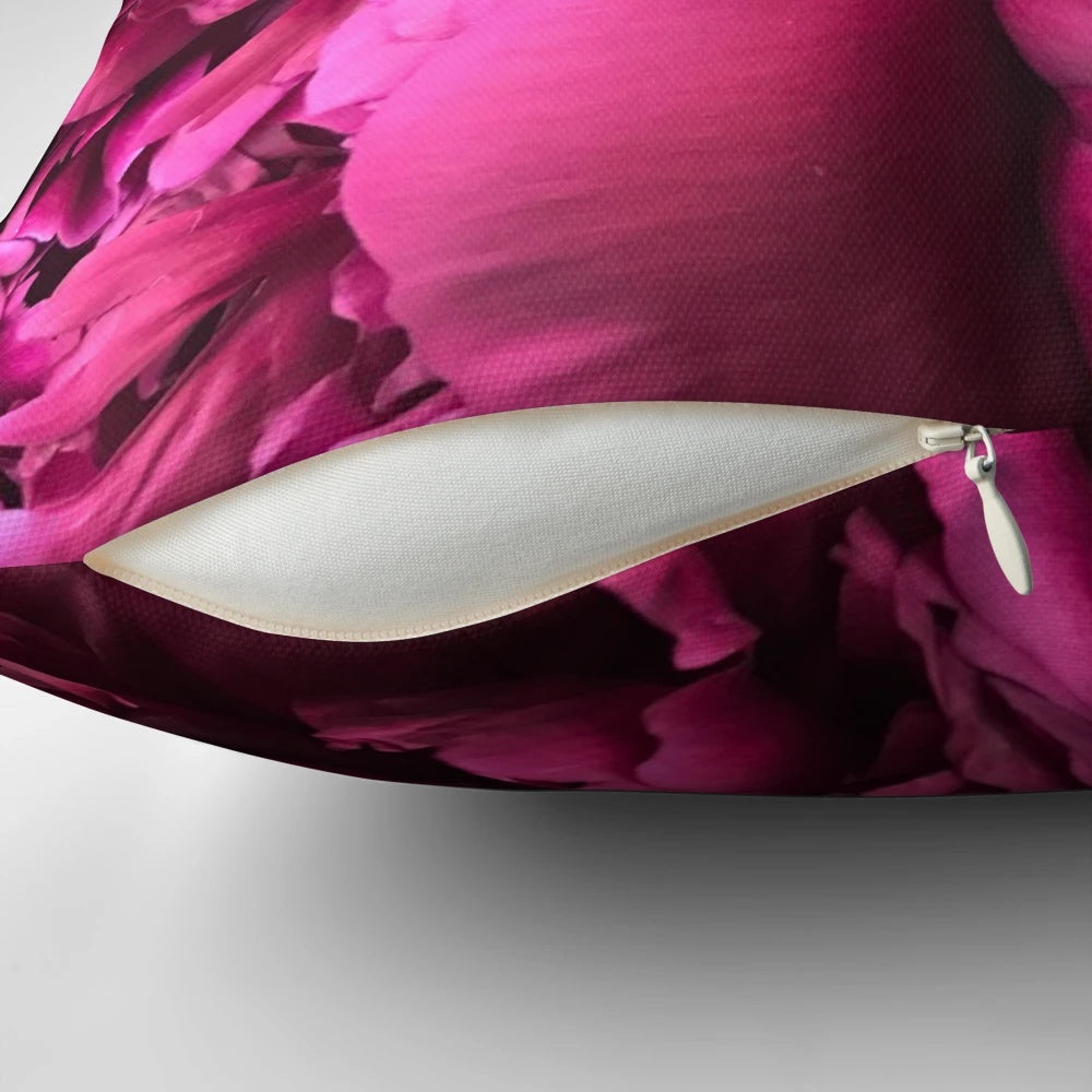 Colorful hot pink peony flowers on a decorative throw pillow