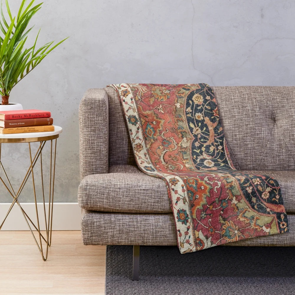 Colorful distressed vintage plush blanket with ornate persian rug pattern