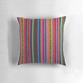 Colorful striped and patterned decorative pillow in Peruvian textile style