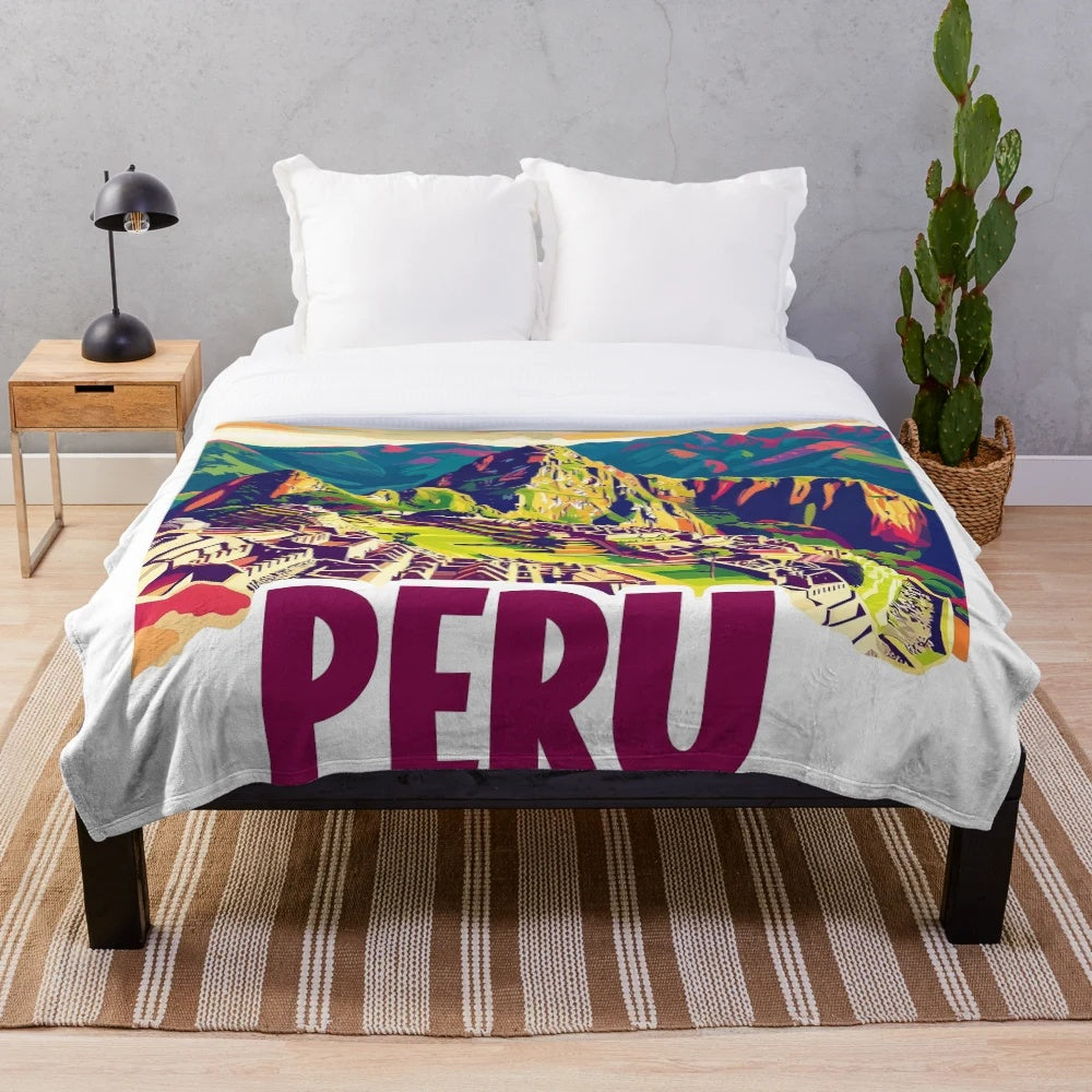 Colorful plush blanket featuring vibrant Peruvian-inspired artwork and patterns