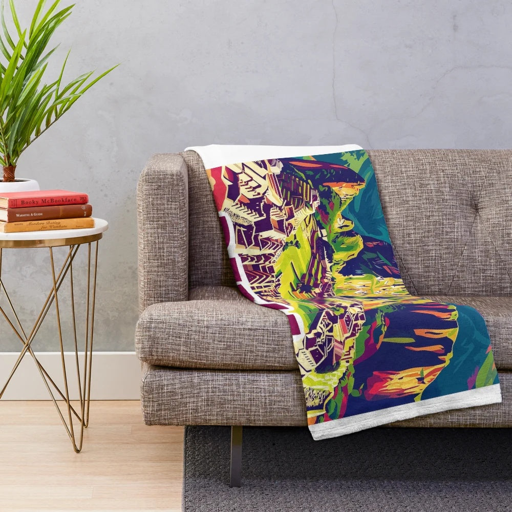 Colorful plush blanket featuring vibrant Peruvian-inspired artwork and patterns