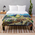 Colorful plush blanket featuring vibrant Peruvian-inspired art and patterns