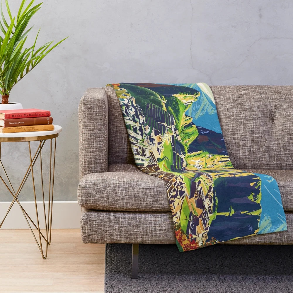 Colorful plush blanket featuring vibrant Peruvian-inspired art and patterns