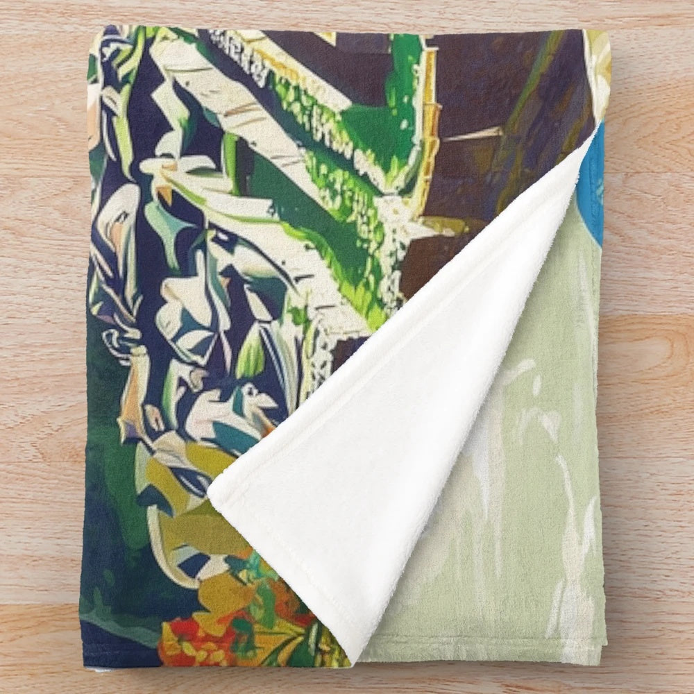 Colorful plush blanket featuring vibrant Peruvian-inspired art and patterns