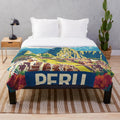 Colorful plush blanket featuring vibrant Peruvian-inspired art and design
