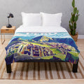 Vibrant Peruvian plush blanket featuring colorful traditional Peruvian art and cultural designs