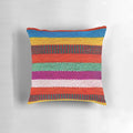 Multicolored striped decorative pillow with Peruvian-inspired pattern