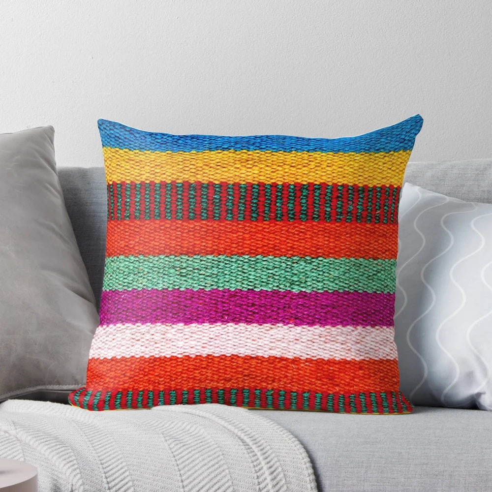 Multicolored striped decorative pillow with Peruvian-inspired pattern