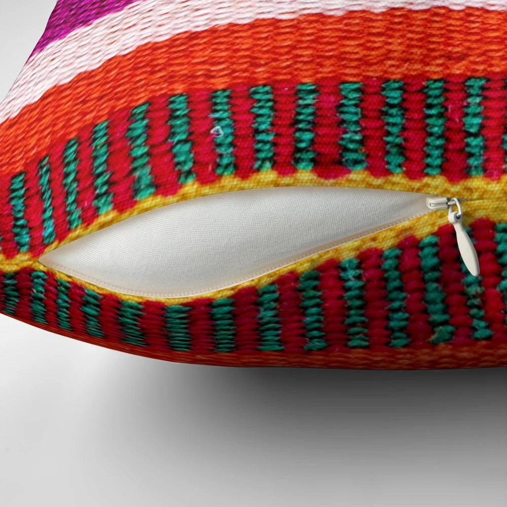 Multicolored striped decorative pillow with Peruvian-inspired pattern