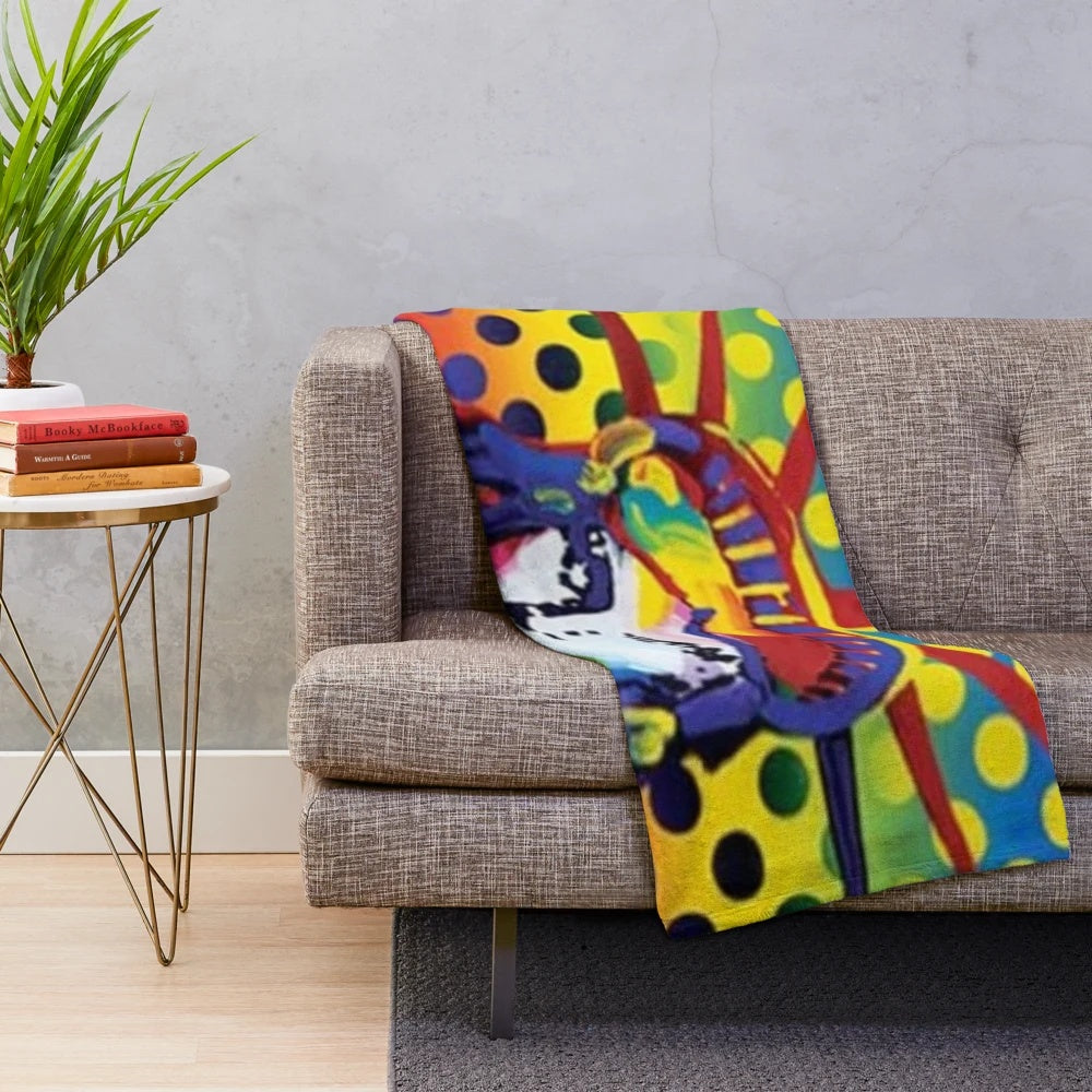 Colorful plush blanket featuring the Statue of Liberty design by artist Peter Max