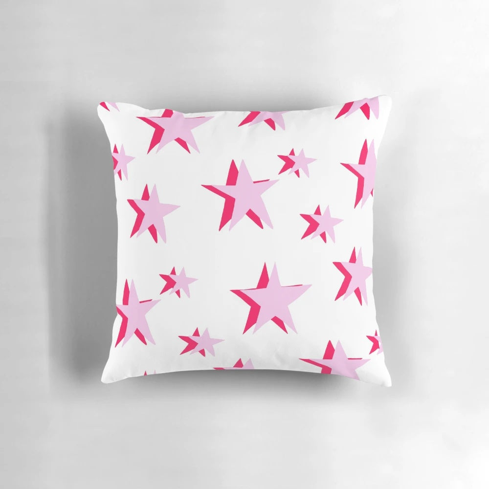 Soft, decorative pink and red star pattern pillow with a VSCO-inspired design