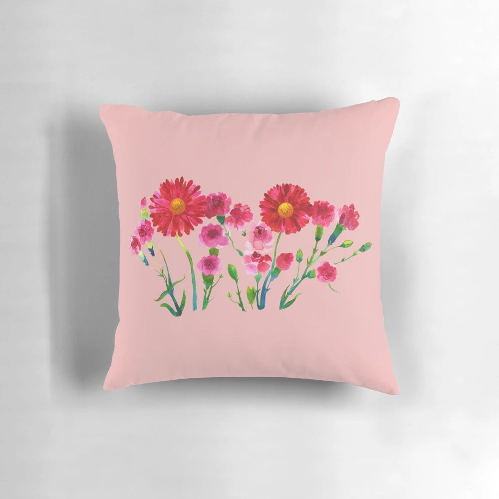 Vibrant pink carnations hand-painted in a watercolor style on a decorative pillow