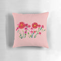 Vibrant pink carnations hand-painted in a watercolor style on a decorative pillow