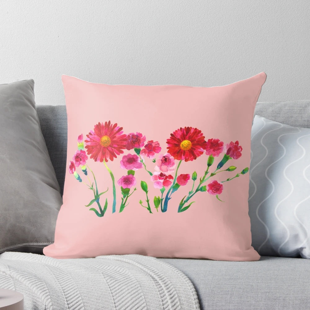 Vibrant pink carnations hand-painted in a watercolor style on a decorative pillow