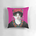 A pink and floral decorative pillow featuring a playful black cat, inspired by the iconic artwork of Mexican artist Frida Kahlo.