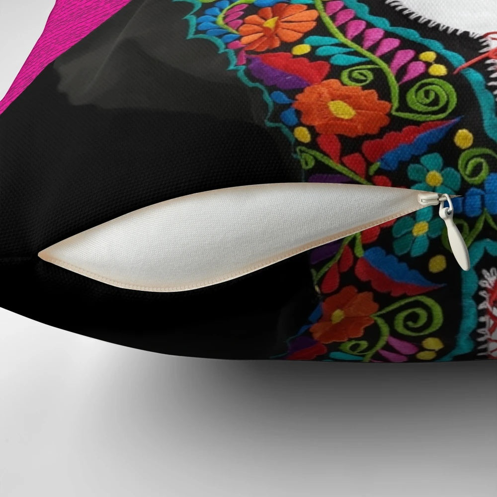 A pink and floral decorative pillow featuring a playful black cat, inspired by the iconic artwork of Mexican artist Frida Kahlo.