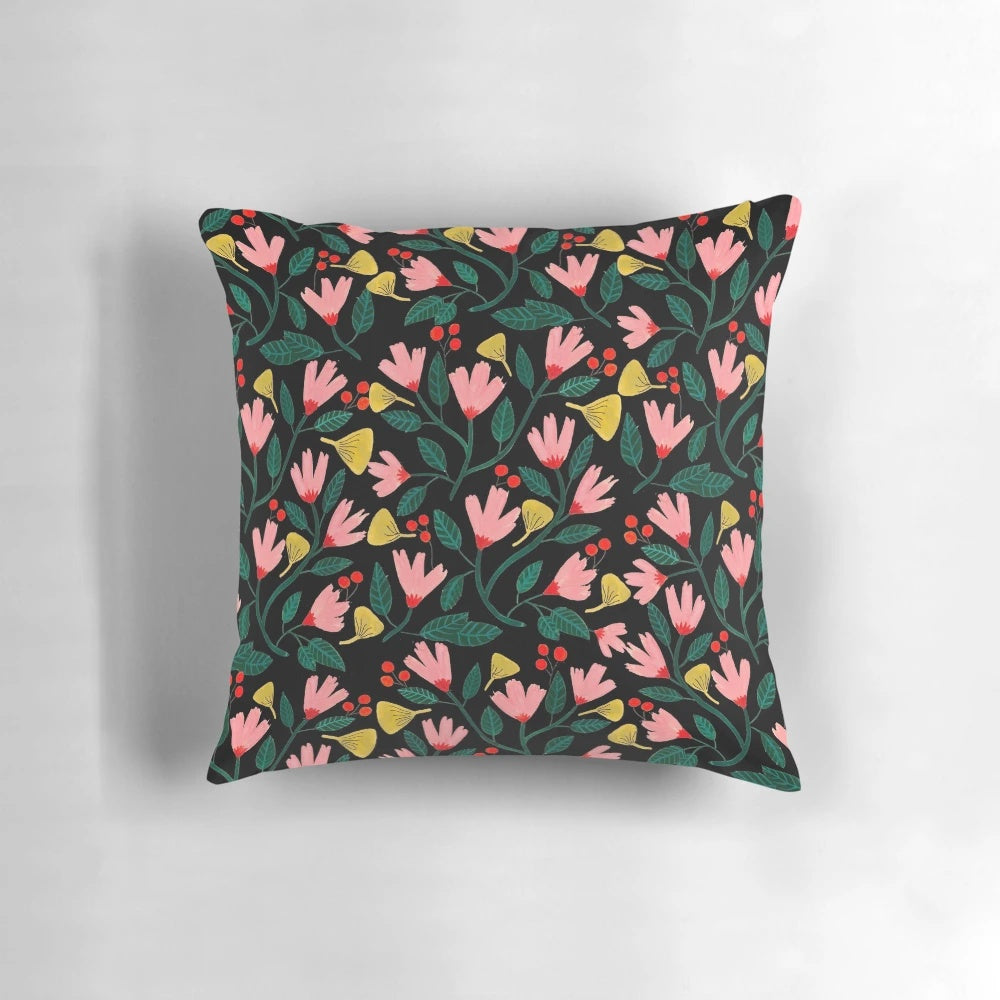 A beautifully designed pink floral pillow with a botanical, watercolor-inspired pattern.