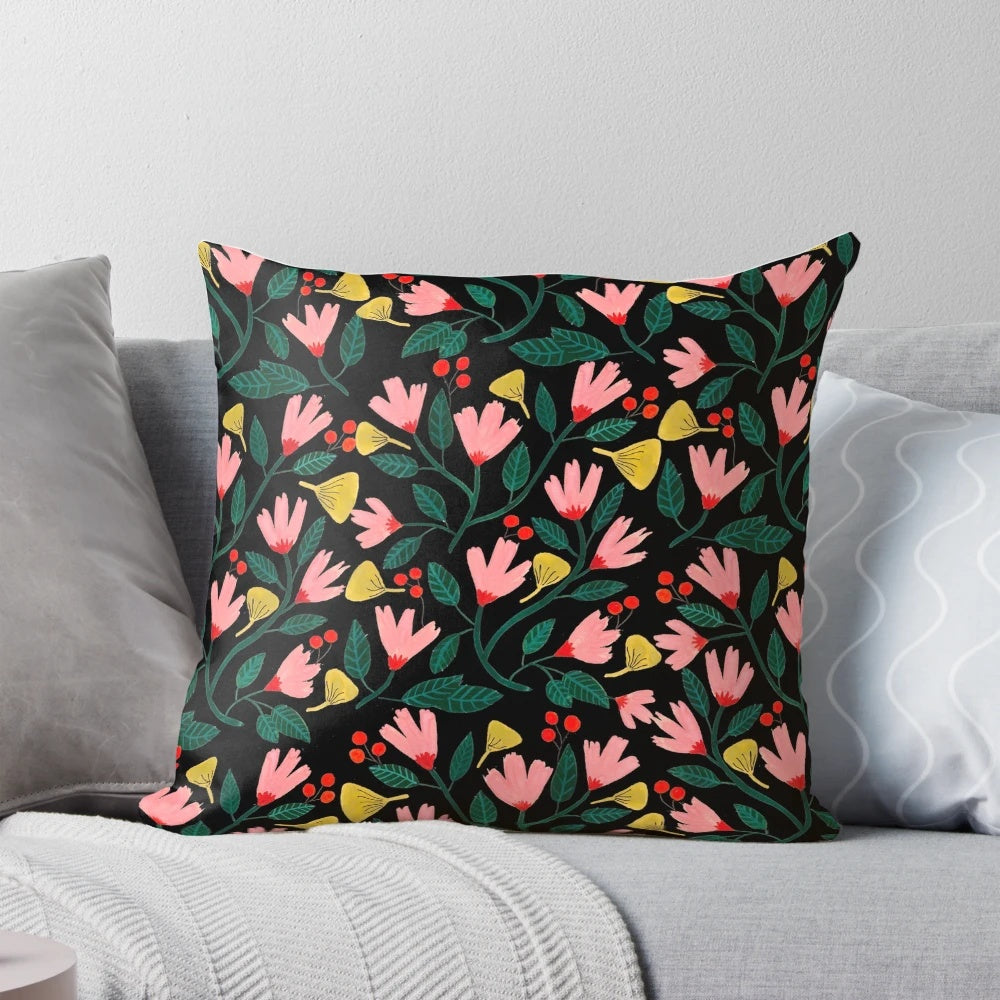 A beautifully designed pink floral pillow with a botanical, watercolor-inspired pattern.