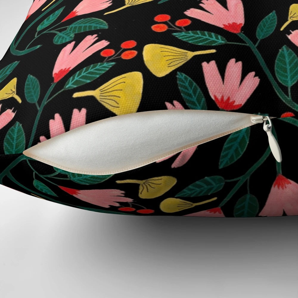 A beautifully designed pink floral pillow with a botanical, watercolor-inspired pattern.