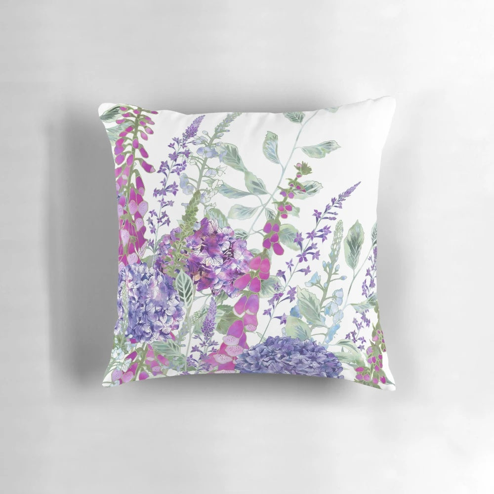 A beautiful pink and blue floral throw pillow featuring foxgloves and hydrangeas, designed by Fiona Calder.