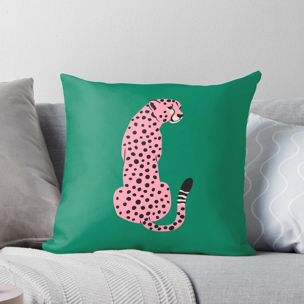 A vibrant pink leopard and cheetah pop art design on a throw pillow